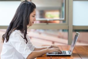 Female typing on laptop