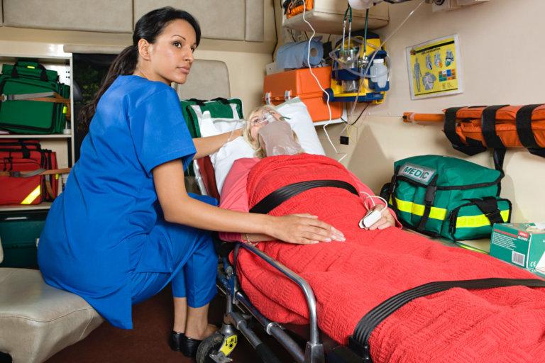 nurse cares for patient in ambulance