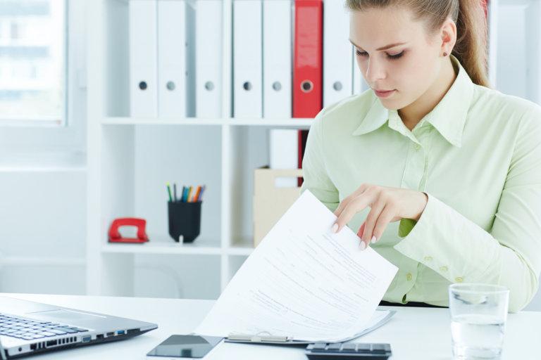 hr assistant in office looking at documents