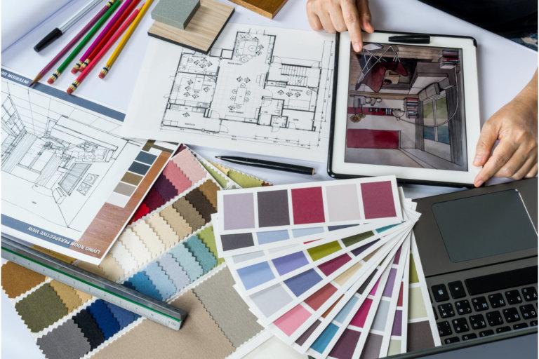 designer looking at pictures and color swatches