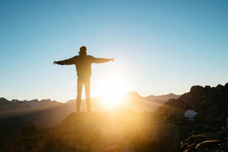 Man standing in front of sunset Christian job search guide.