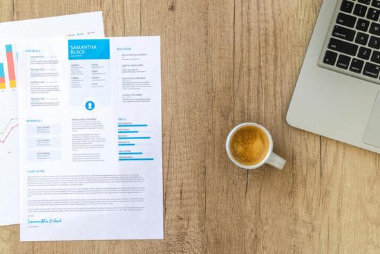 Resume on desk showing how to list security clearance on a resume