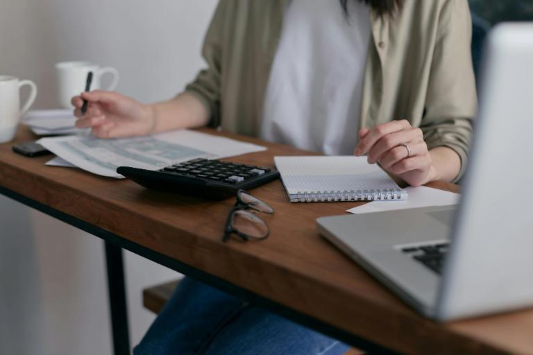 Person working at a desk exploring high-paying careers without a degree