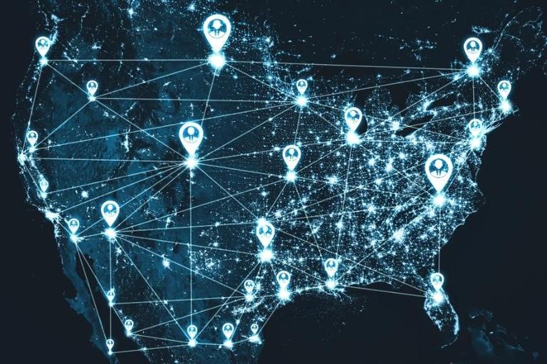 US map with glowing network lines and human icon pins connecting major city talent corridors.